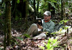 A moment of leisure for Derek reading a book in the jungles of palau