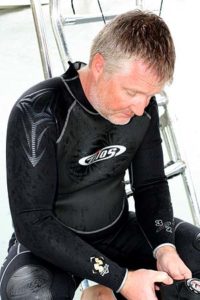 mark checking gear before dive, palau