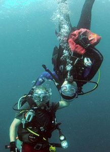 divers taking a safety stop while diving in palau with bentprop.org