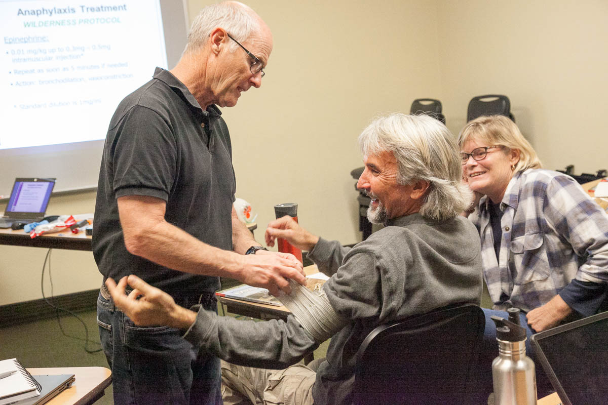 Wilderness First Responder Course learning to apply large bandage
