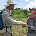 Glenn Frano receives his BentProp Coin on his first mission in the jungles of Palau by Team Leader Pat Scannon during Palau WWII POW search