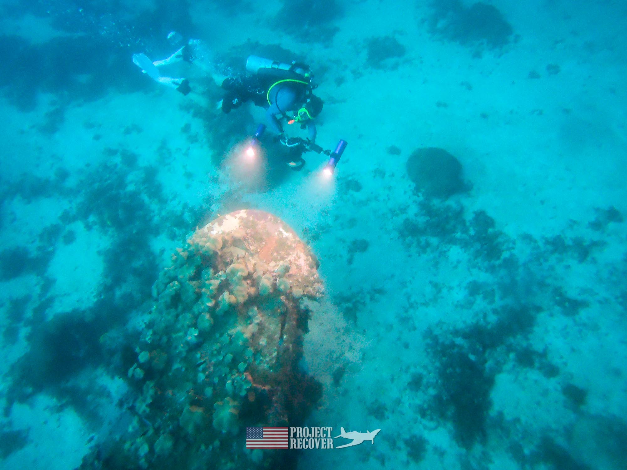 Harry Parker filming for a 3D model of the WWII aircraft Wreck in the Solomon islands while scuba diving mia crash sites. Project Recover and BentProp Project are committed to bringing the MIA home. Photo by Charlie Brown