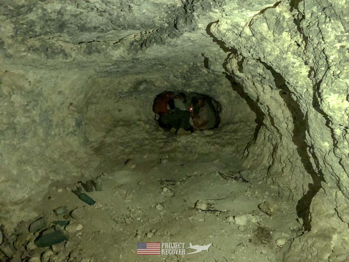 Project Recover and Cleared Ground Demining team members inside WWII Japanese cave on Peleliu.