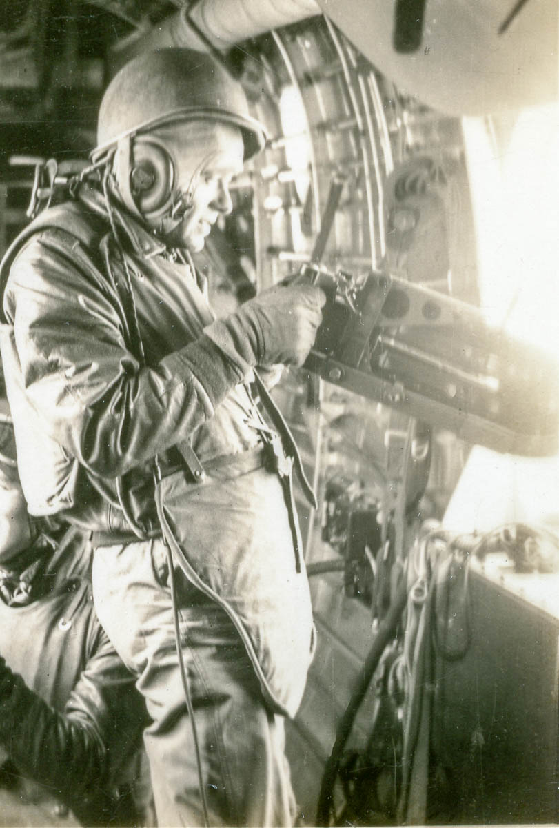 SSgt. Herbert Farnam, waist-gunner, shooting from B-24 WWII